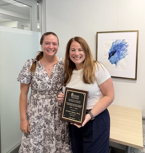 Dr. Gaylen Fronk (left) and Dr. Jennifer Dahne (right), with her Outstanding Research Mentor  Award from the Psychology Internship Program. Dr. Fronk was one of the interns mentored by Dr. Dahne.